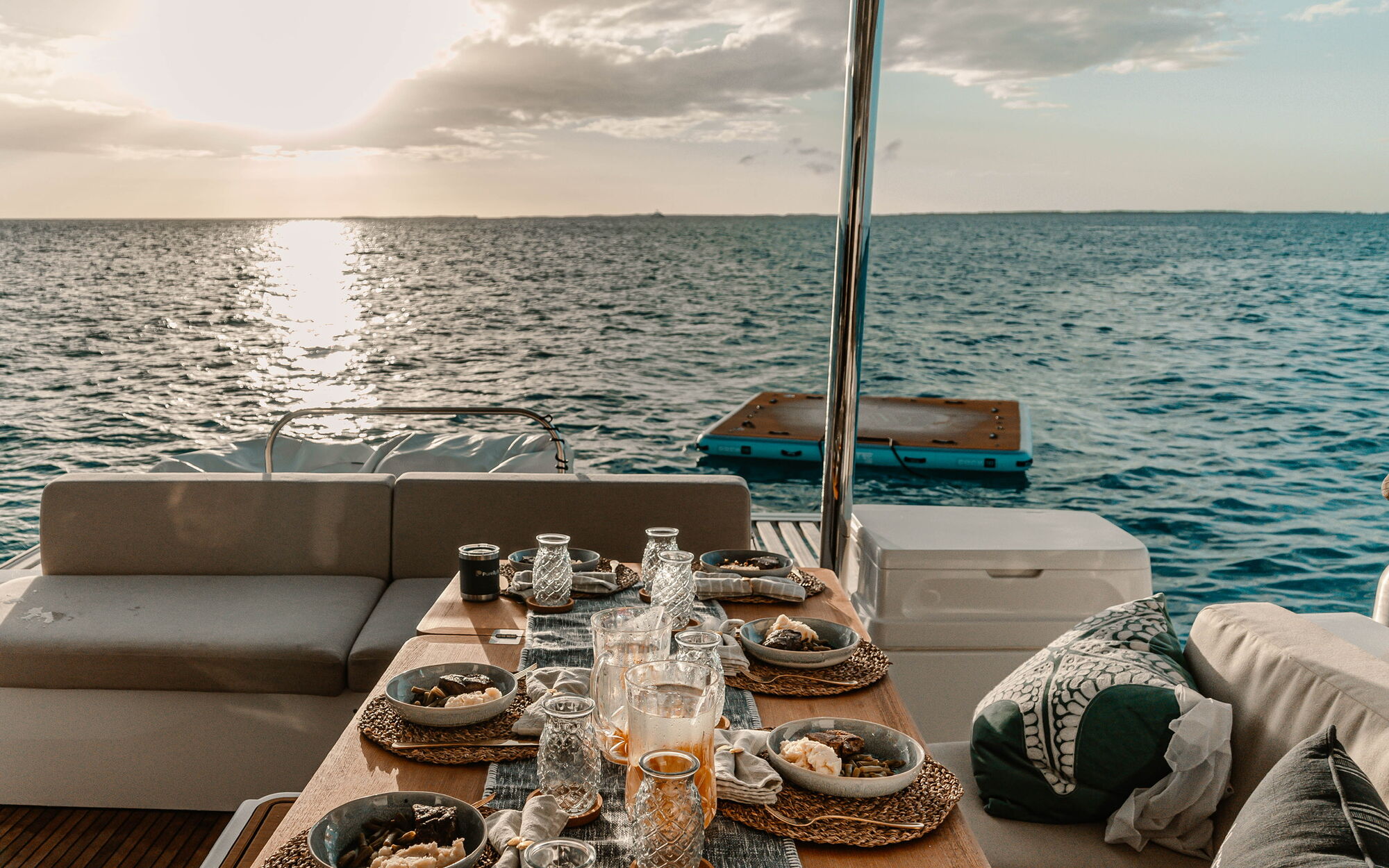 Cockpit dining table elegantly set for dinner at golden hour